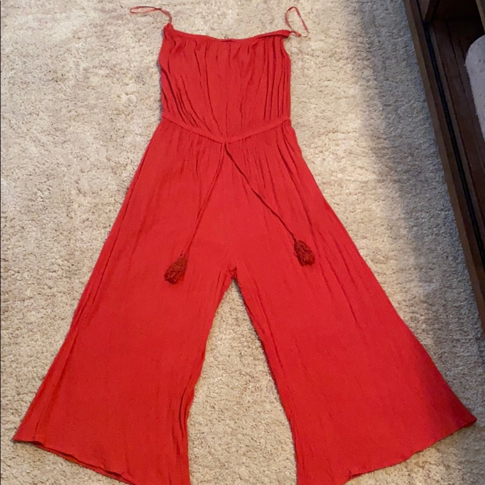 Pink Lily strapless romper in pink. Size medium.